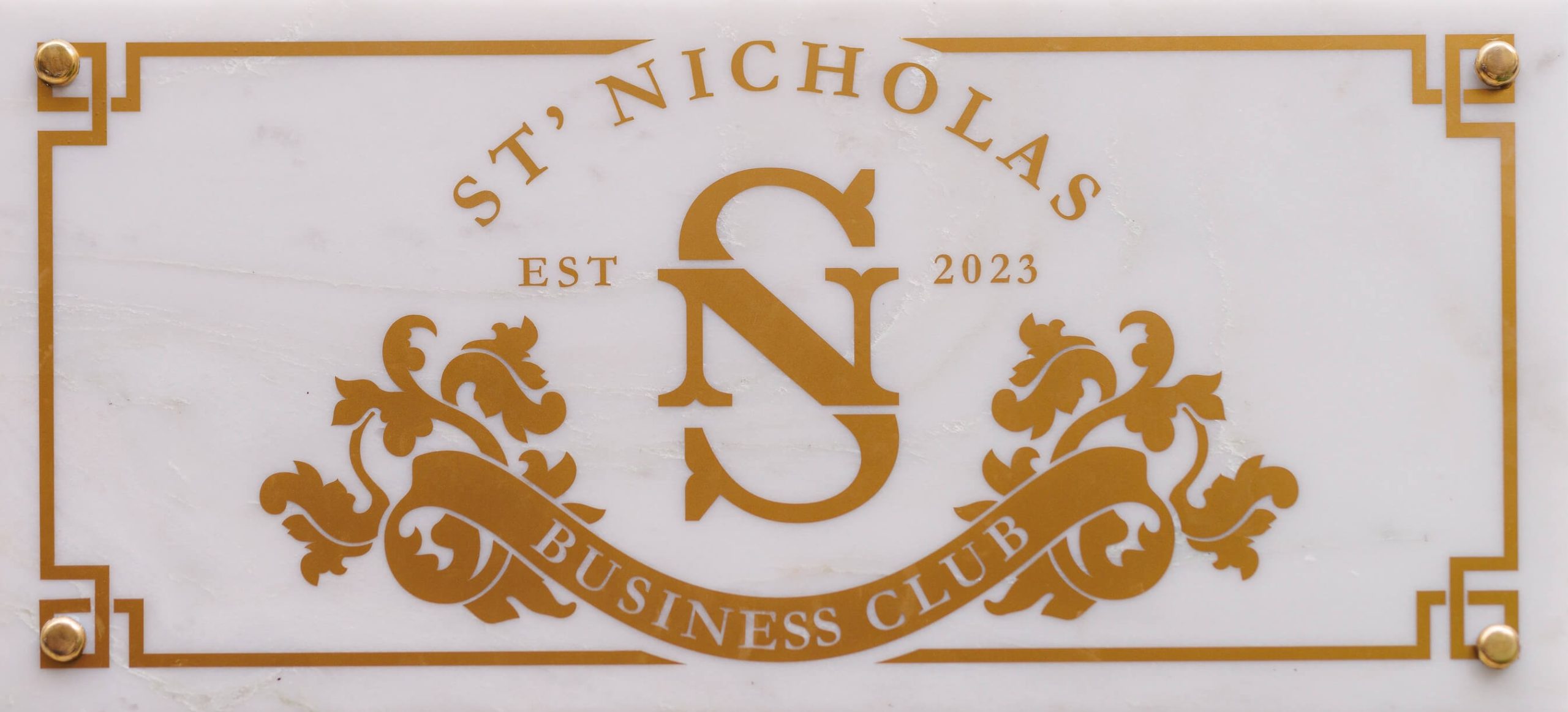 st Nicholas Business Club logo on marble